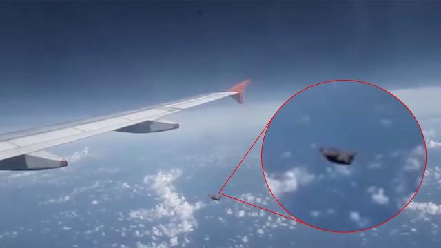 UFO 'Follows' a Plane!! Real UFO Caught On Tape!!