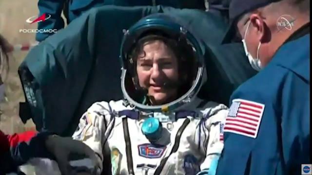 Astronauts greeted by mask-wearing crews upon Earth return