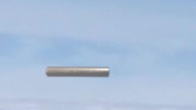 CIGAR SHAPED UFO filmed from airplane over CHINA !!! June 2016