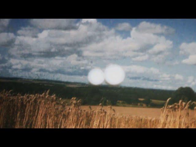 A Crop circle being created by a UFO for the first time caught on film