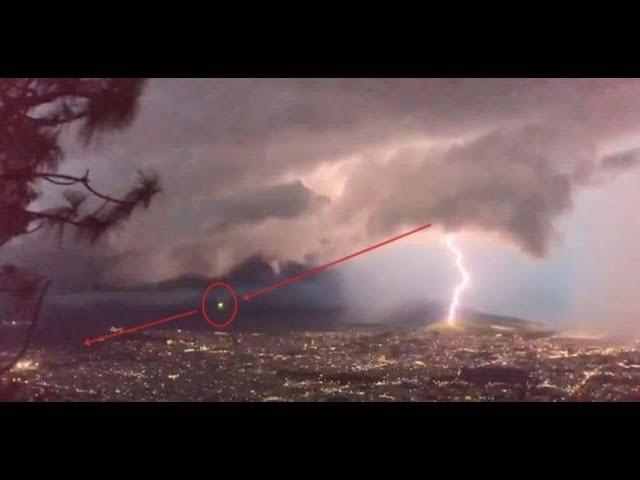 Strange spherical object shoots out of the clouds during lightning storm over Mexico