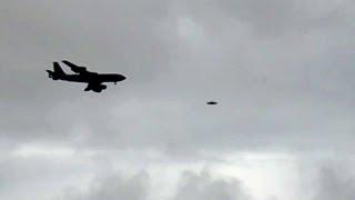 UFO Sightings Military Airforce Transport Flanked By Flying Saucer? What Is It? 2013