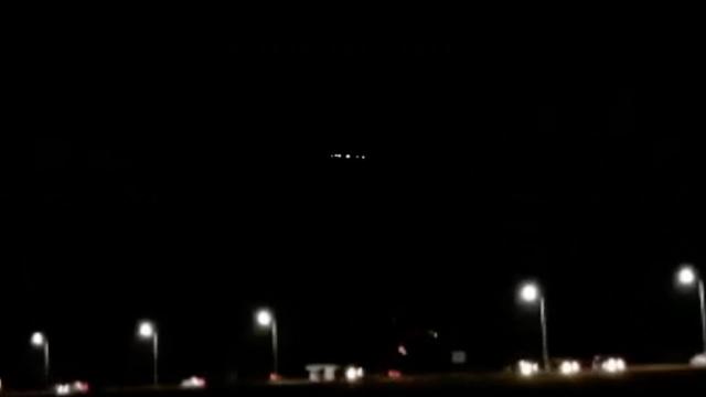 Strange Disk Shaped Rotating UFO Lights Sighted By Group Of People Above Bridge in Argentina