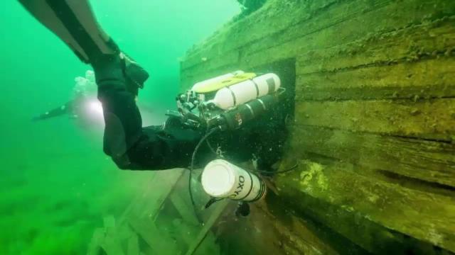 Divers Exploring Underwater Building And Found This