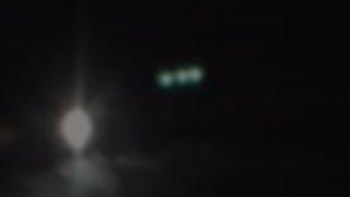 AWESOME UFO SIGHTING! UFO WITH THREE GREEN LIGHTS FLYS LOW OVER FOREST