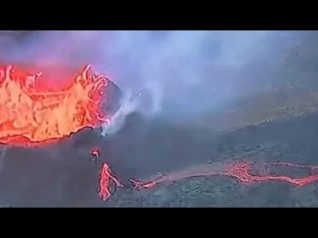 A UFO flies over an erupting volcano in Iceland