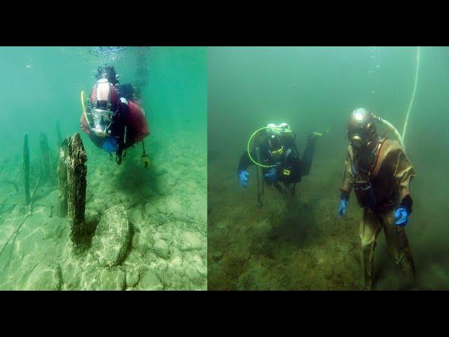 Divers explore 5,000 year old stone piles submerged in alpine lake