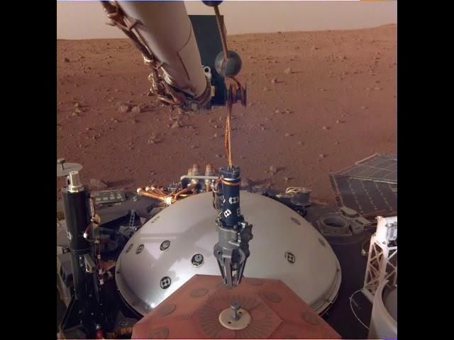 Watch NASA Mars Insight's Claw Grab a Seismometer