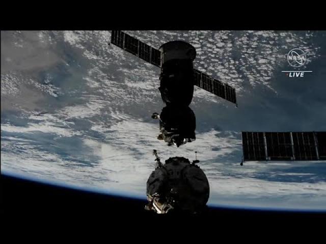 Soyuz carrying 3 cosmonauts undocks from space station for return trip