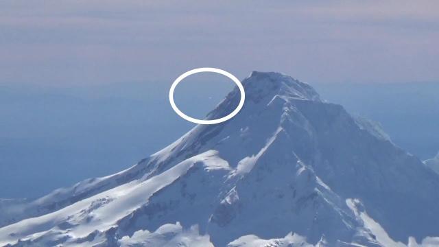 UFO entering Mount Hood caught on video by an airplane Pilot