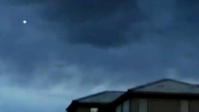 Blue Colored UFO with Glowing Light During Thunderstorm over Buckeye, Arizona - FindingUFO