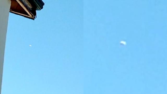 Disk Shaped UFO in Cloudless Sky Filmed by Kid on Rooftop over the Philippines - FindingUFO
