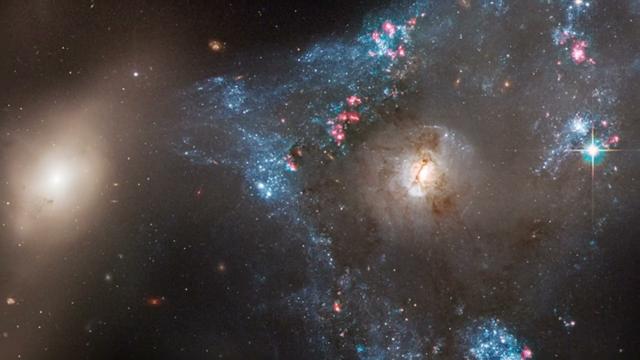 Galactic mashup generates 'triangular-shaped star-birthing frenzy!' See Hubble imagery