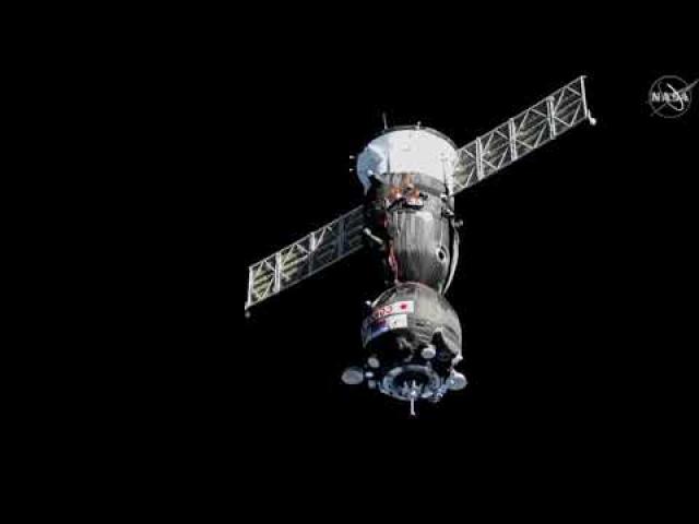 Soyuz with Japanese billionaire aboard docks with space station