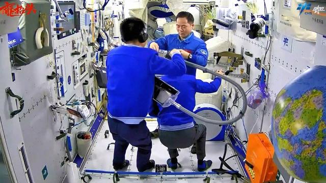 Haircuts in space are team effort aboard Chinese space station