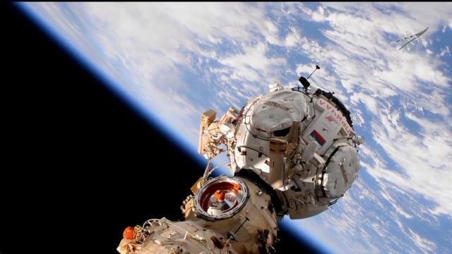 Watch empty container float away from space station after spacewalk toss