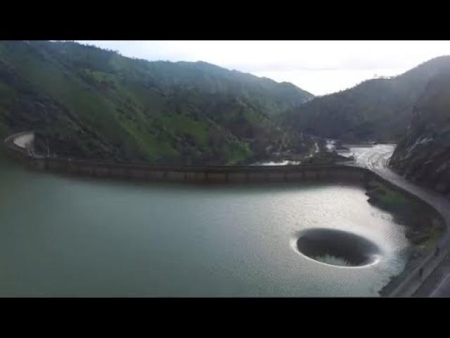 He Flew His Drone Over This Strange Hole In A Lake And The Footage Left Him Floored